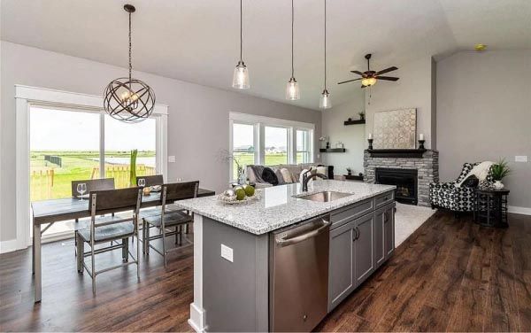 A kitchen with a large island in the middle of the room.