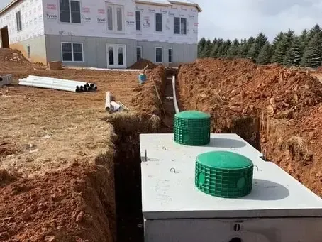 Septic tanks installed in a trench at a house construction site