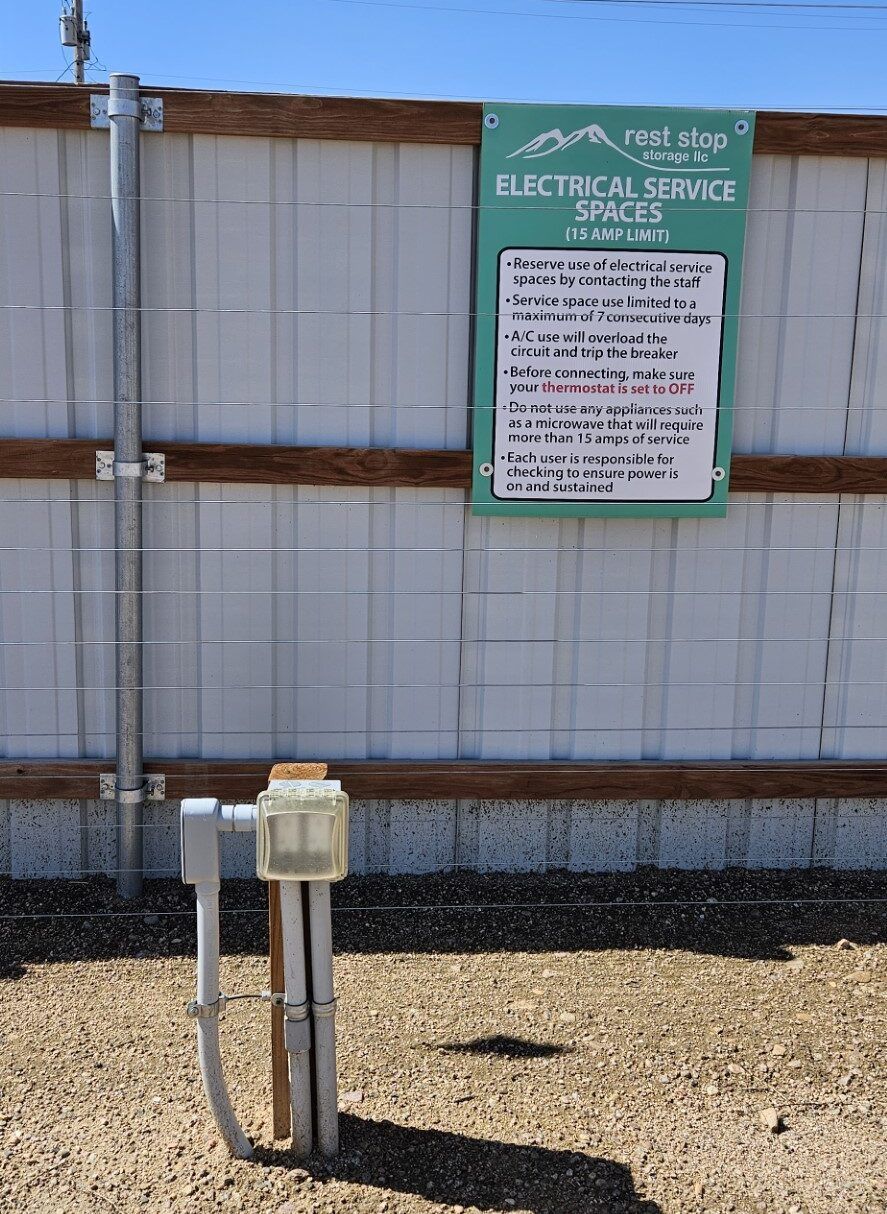 A fence with a sign on it that says electrical service
