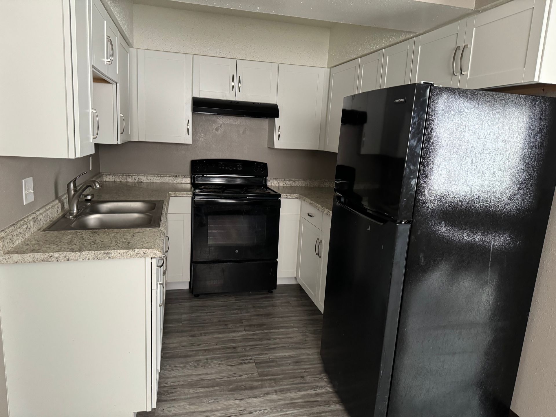 Photo showing a U-shaped kitchen
