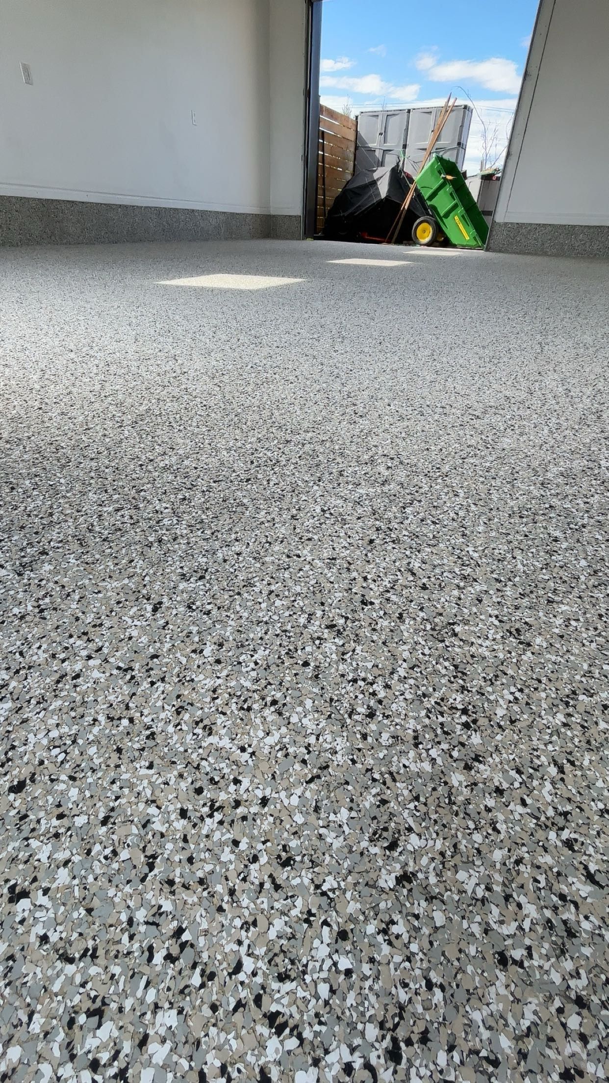 A close up of a concrete floor in a garage.