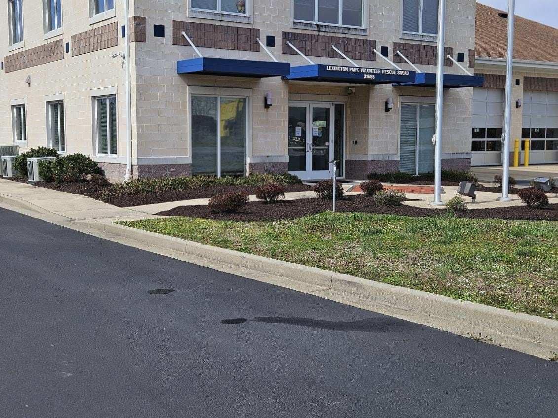 A large building with a blue awning over the entrance