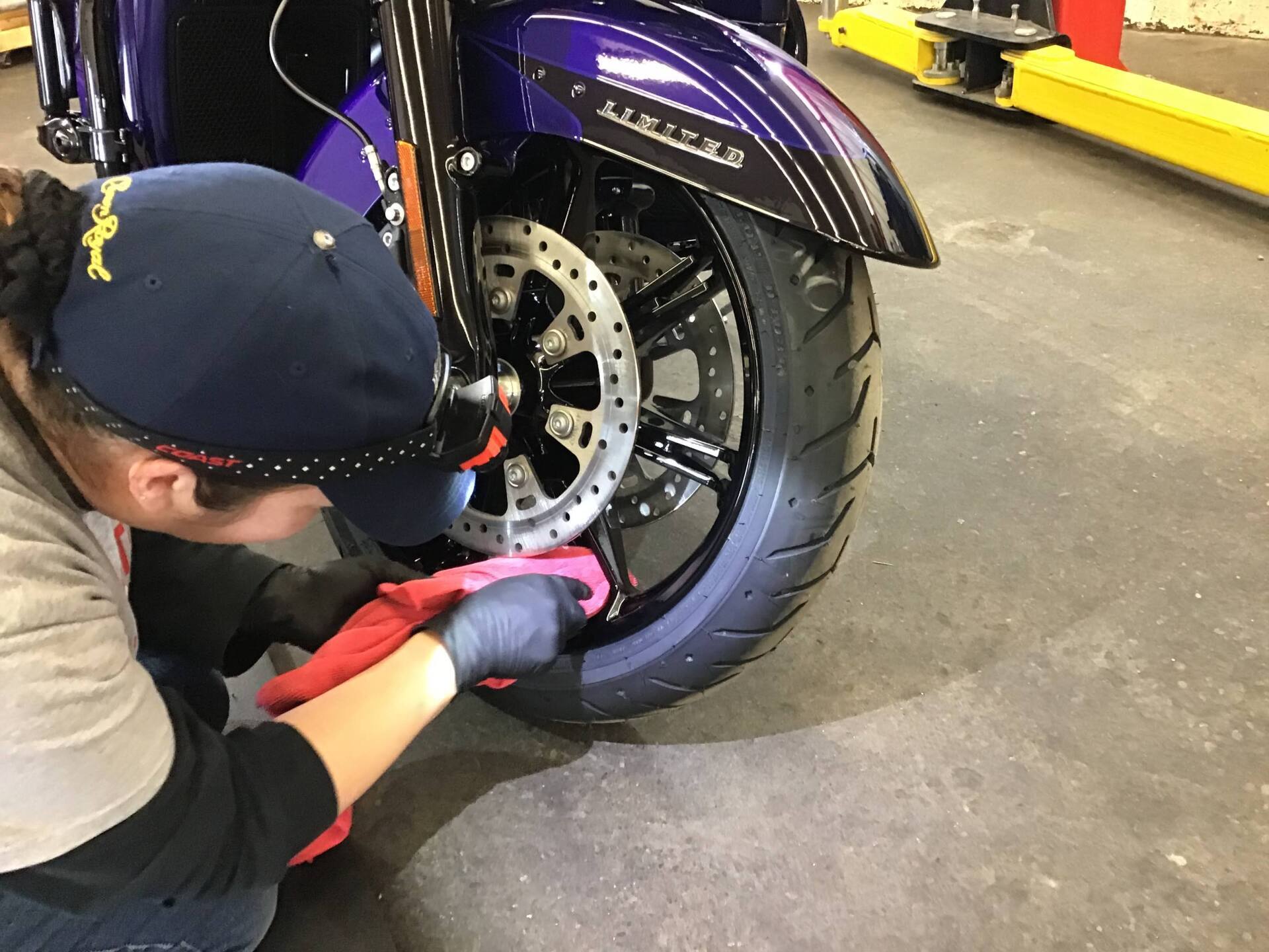 Worker Clean The Motor Mugs and Tire — Kamloops, BC — Kamshine Automotive Detailing Ltd.