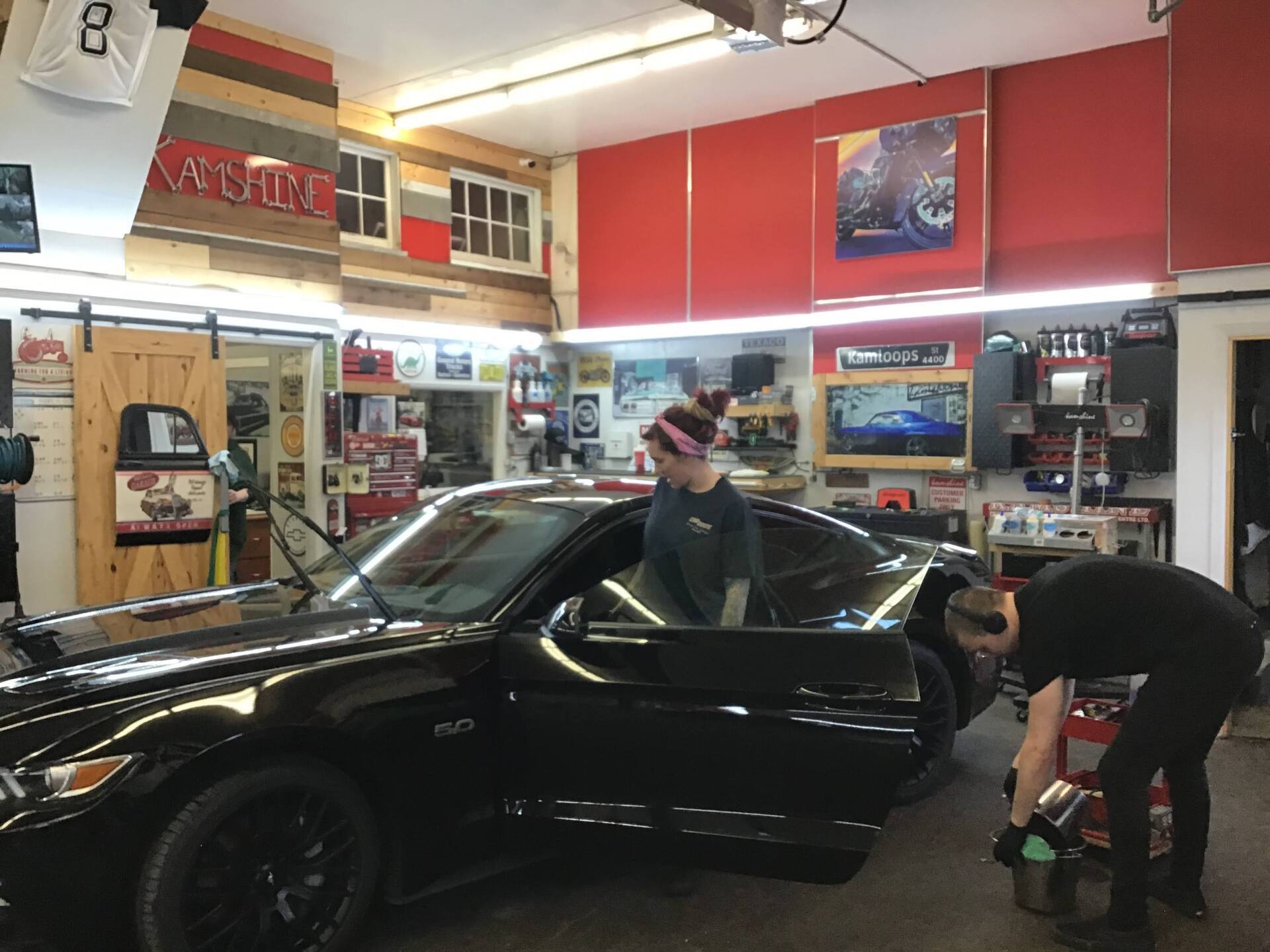 Man Cleaning the Shop After Car Coating — Kamloops, BC — Kamshine Automotive Detailing Ltd.
