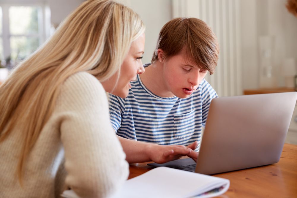 Woman And Child With Down Syndrome Using Laptop — Side By Side Support Services Casino In Casino, NSW