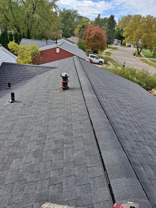 Side View of the House With Newly Installed Roof. Roofing Contractor Detroit. Roof Repair Near Me in Lansing