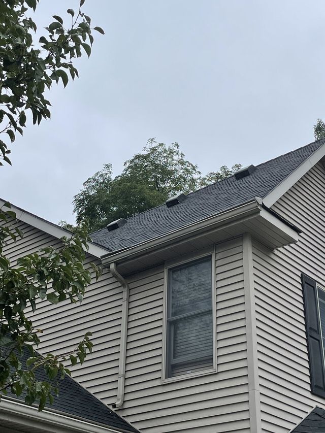 Residential House With New Roof. Roofing Contractor Detroit. Roof Repair Near Me in Lansing