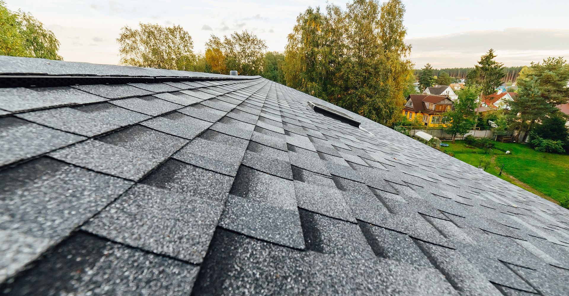 A close up of a roof with a lot of shingles on it.