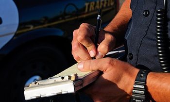 Elmira Attorney — Police Officer Writing A Ticket in Elmira, NY