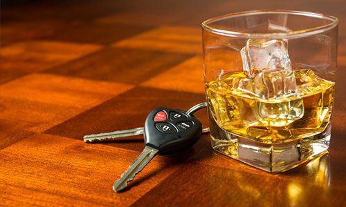 Law Office In Elmira — Car Keys With Glass Of Whiskey On Table in Elmira, NY
