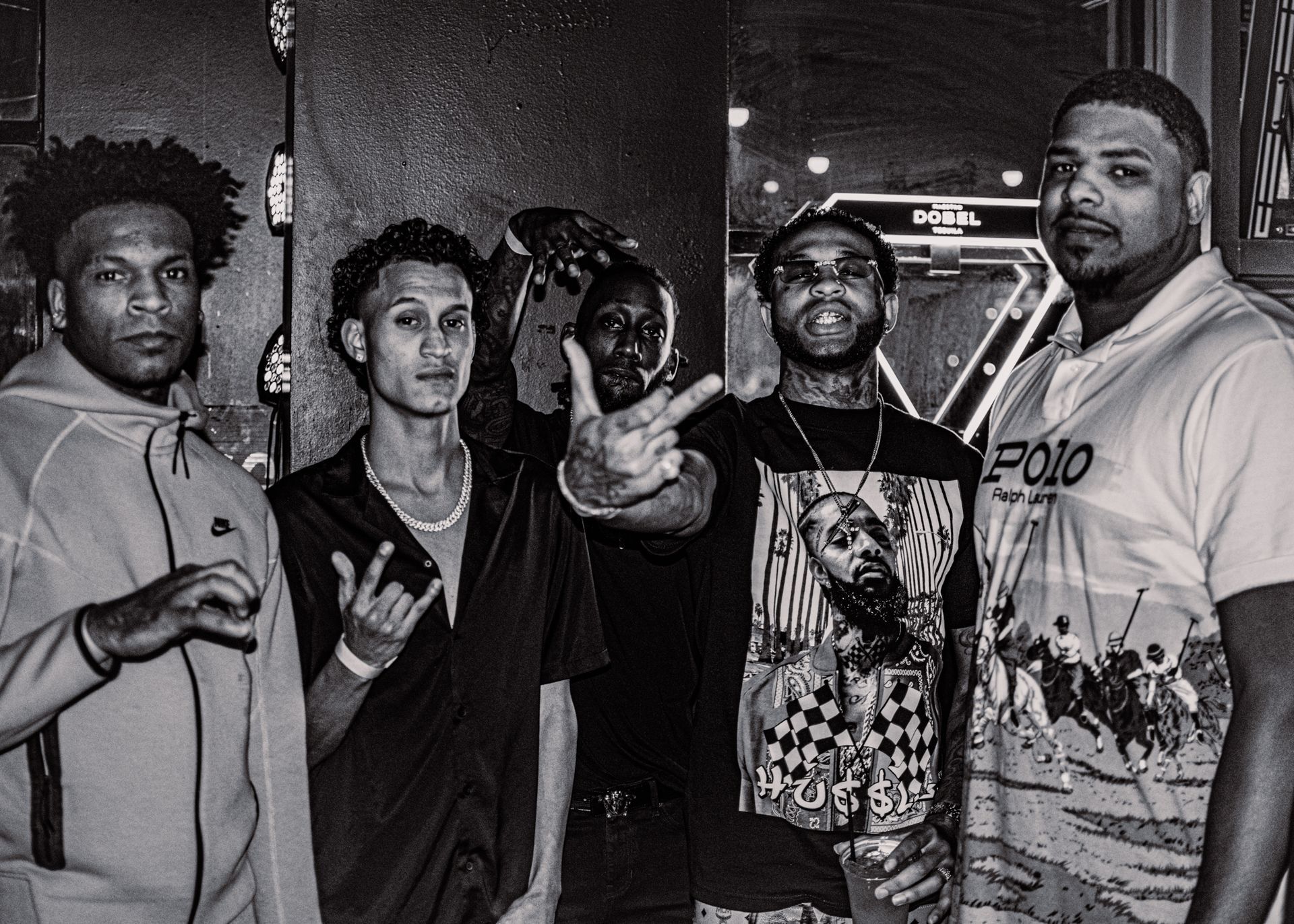 A group of men are posing for a picture in a black and white photo. Trevion500