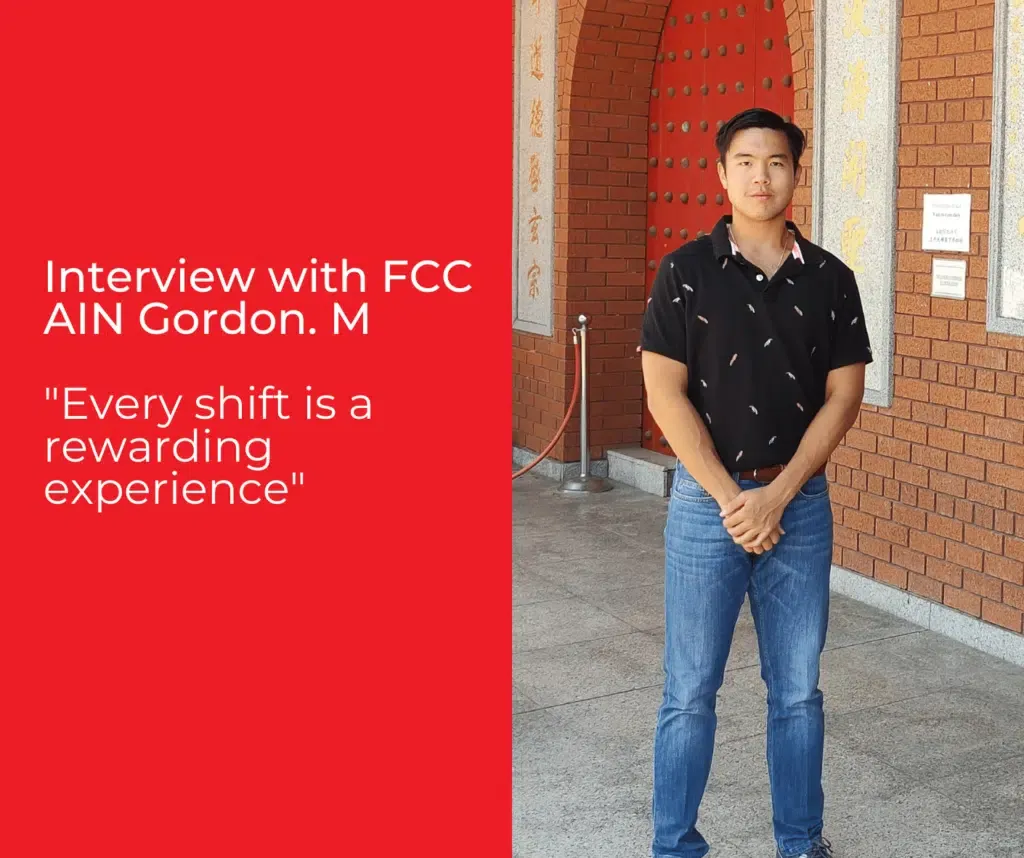 A man standing in front of a brick wall with the words interview with fcc ain gordon m