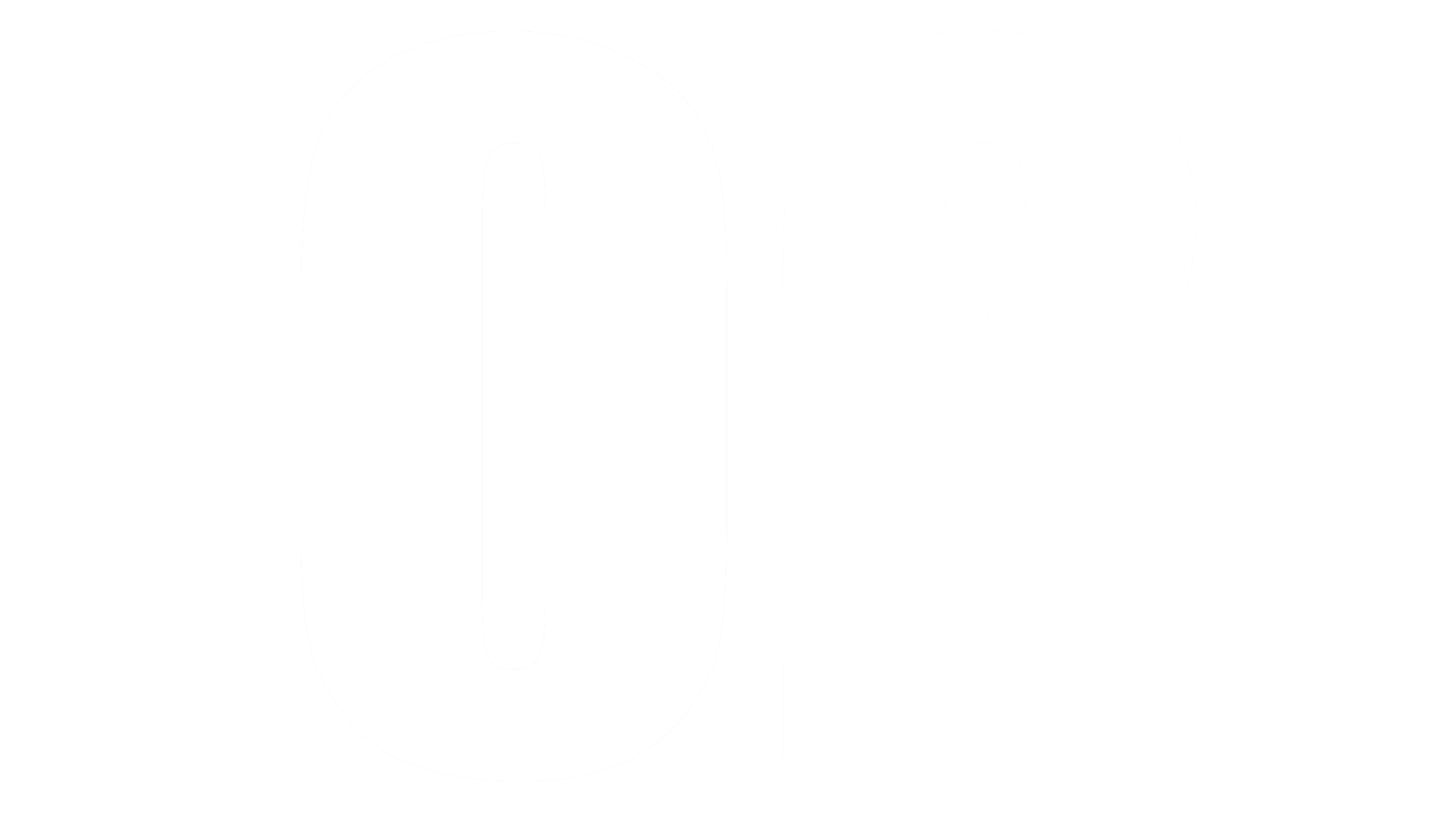 Primo piano di un fiore di ibisco giallo brillante con uno stame centrale lungo e ben definito, su uno sfondo verde sfocato.