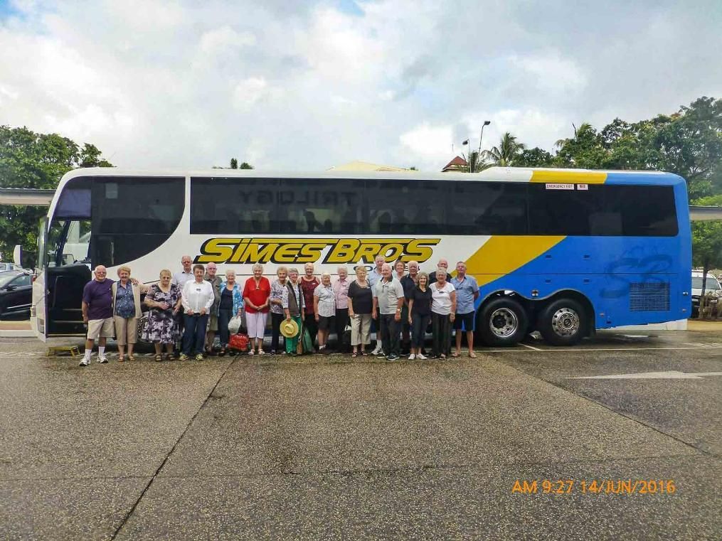 People Taking a  Photo in Front of A Bus that Has Simes Bros Written on It — Simes Bros Coaches in South Lismore, NSW