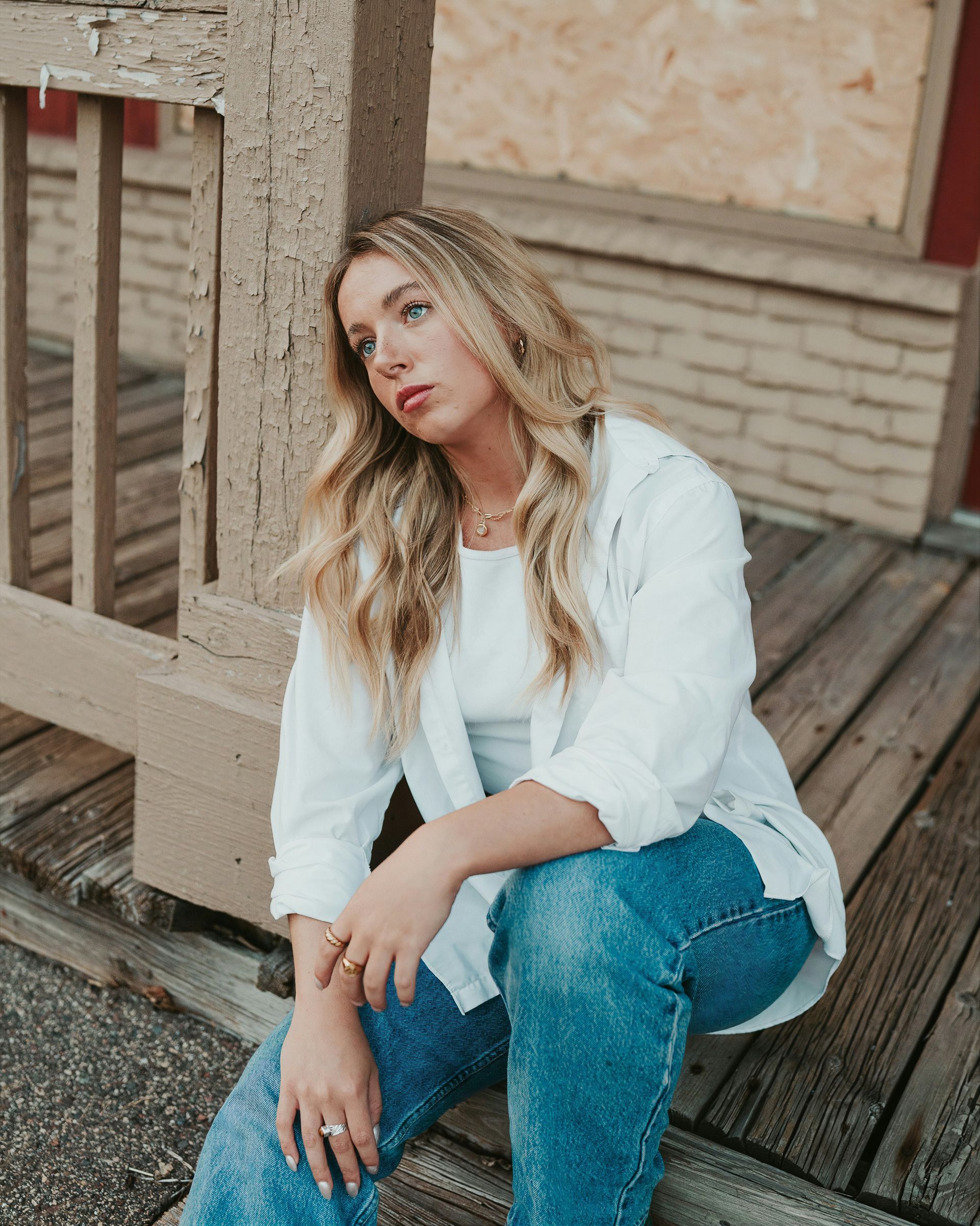 Reflective woman sitting outdoors