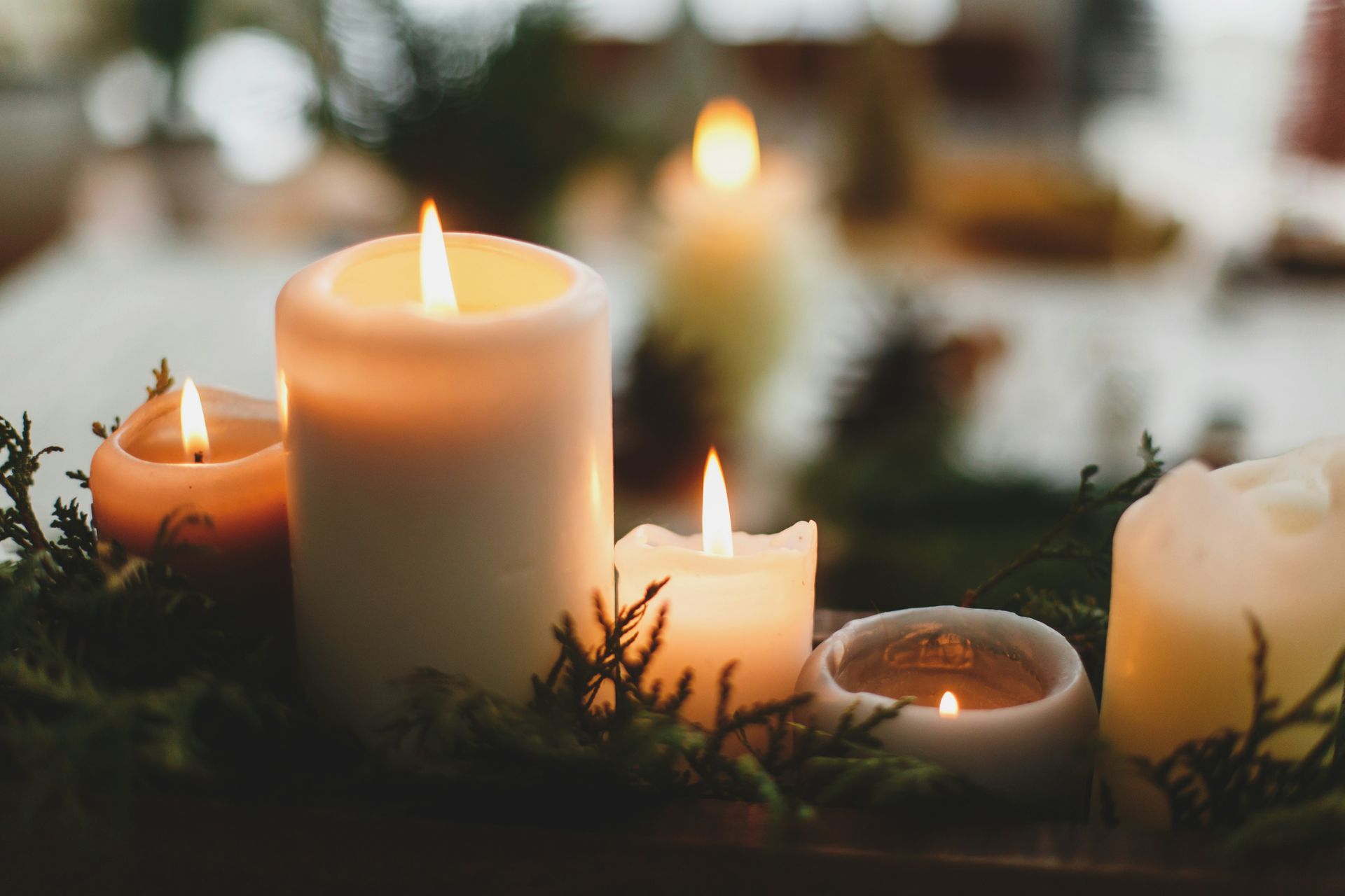 Lit candles during the Christmas season, symbolizing warmth, peace, and quiet reflection.