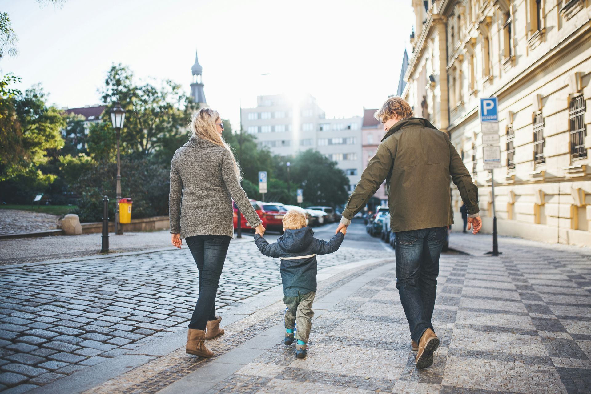 A family walking together, showing how children learn through the actions they see every day.