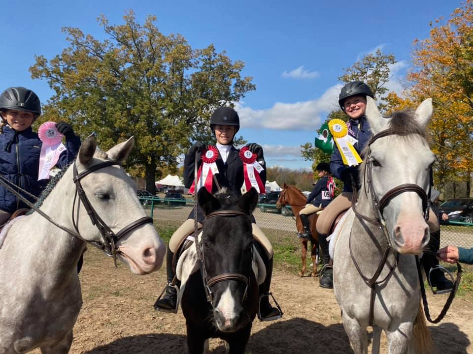 Image shows three horses with riders and their ribbons from a competition to show clients the event that Kings Meadow is hosting.
