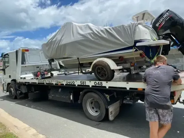 A Boat on A Trailer Being Transported by A Tow Truck — Sundance Auto & Machinery Pty Ltd In Midge Point, QLD 