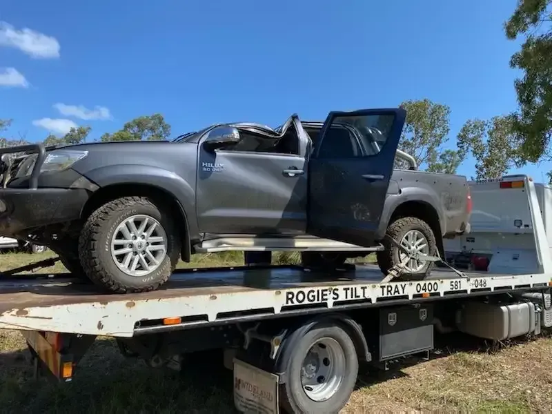 Damaged Gray Pickup Truck on A Tow Truck — Sundance Auto & Machinery Pty Ltd In Mackay, QLD