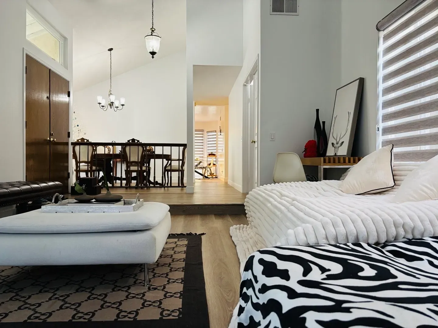 A living room with a zebra print ottoman