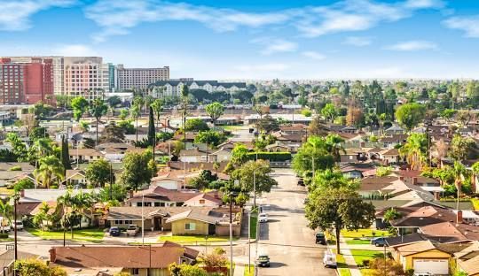 An aerial view of a residential area with lots of houses and trees.
