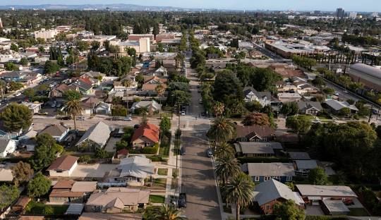 An aerial view of a residential area with lots of houses and trees.