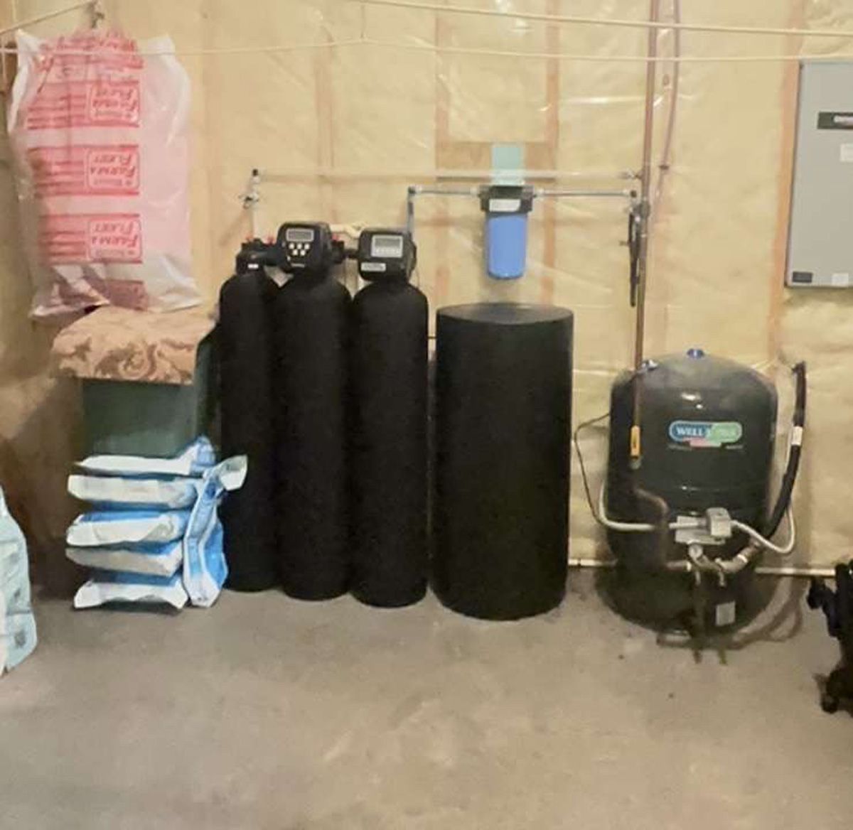 A bunch of black cylinders are sitting in a room