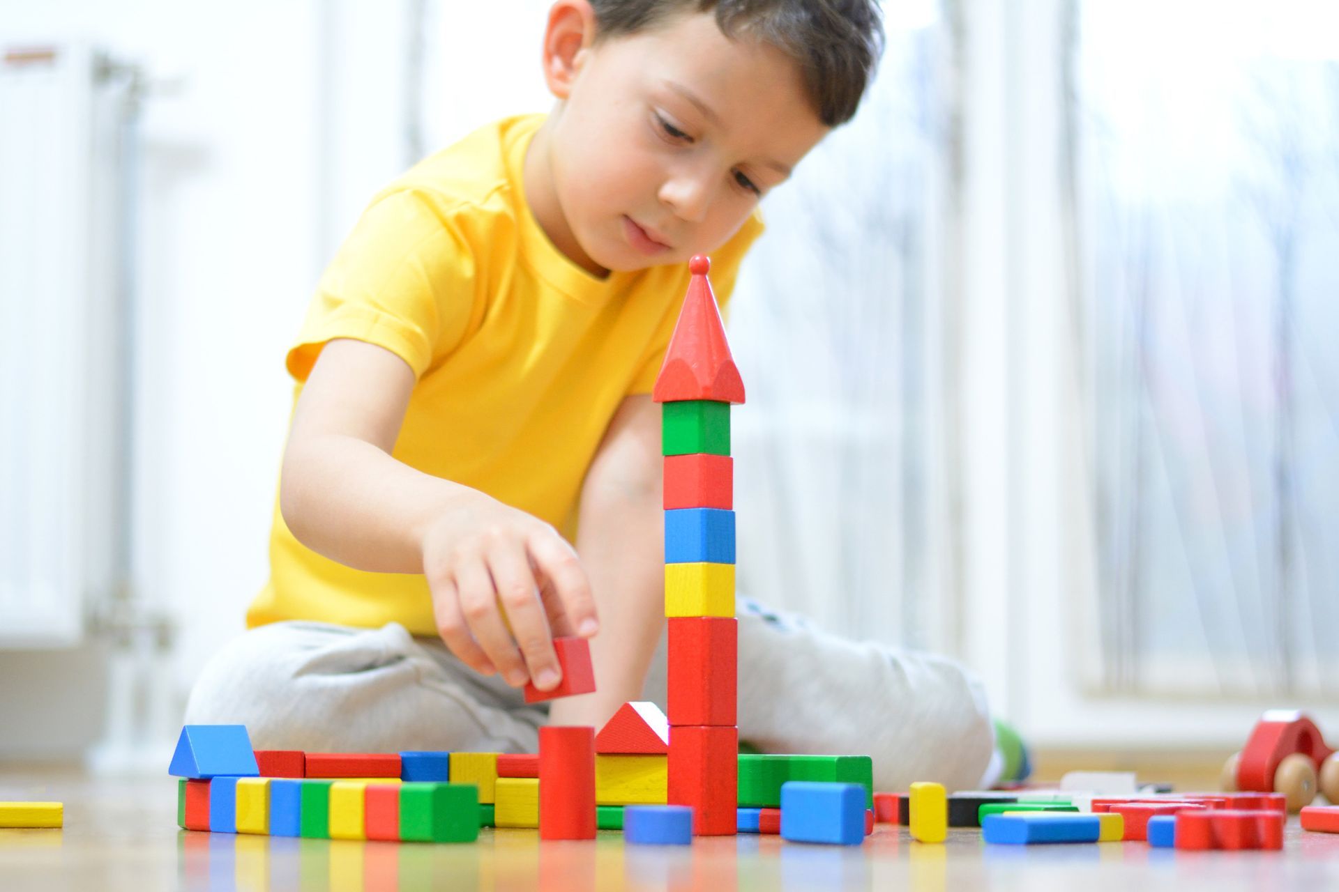 Child is Playing With Cubes — Cedar Rapids, IA — Family Psychology Associates