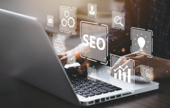 A graphic showing a laptop with components of SEO marketing. 