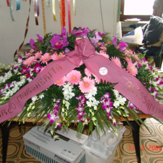 composizione di gerbere rosa e orchidee fucsia