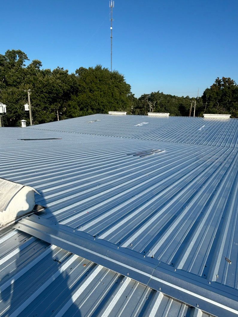 A metal roof with a blue sky in the background