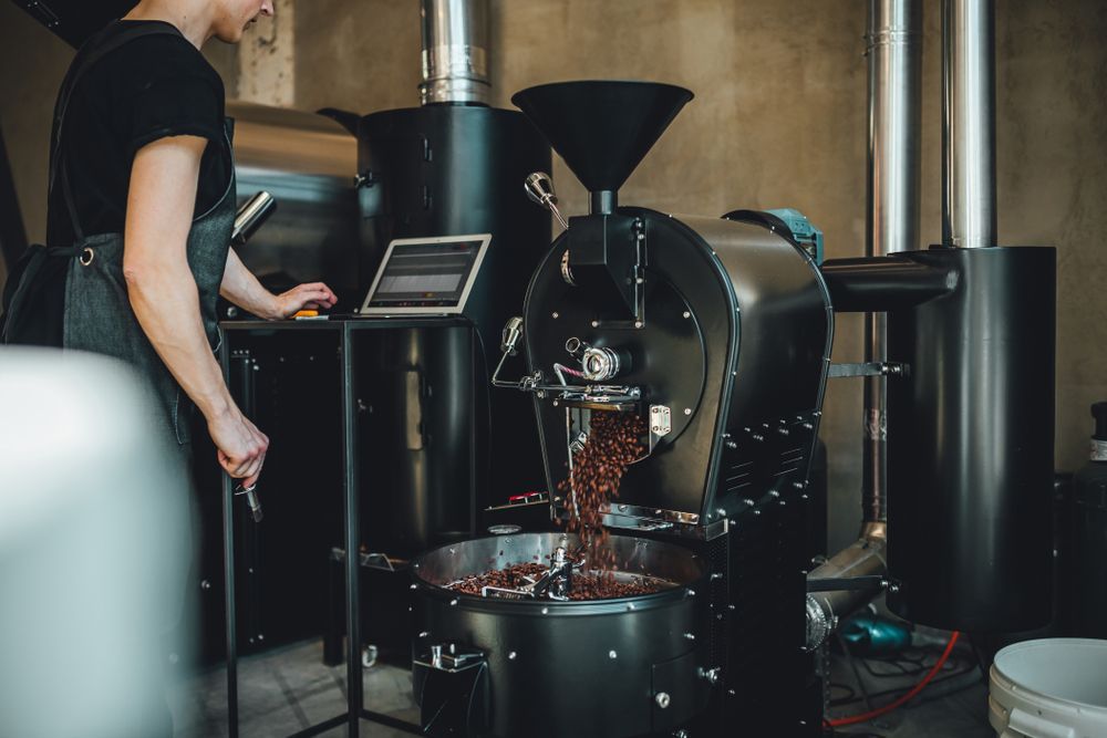 A Person Monitors a Professional Coffee Roaster — Premiair Refrigeration, Air Conditioning & Electrical in Gunnedah, NSW