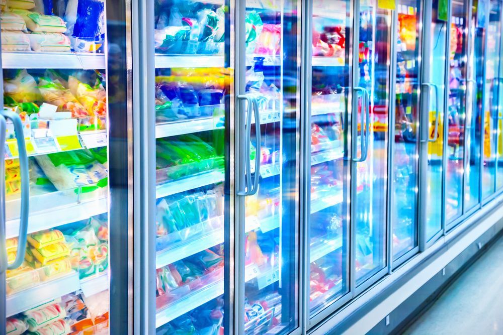 A Glass-fronted Freezer Cases in a Grocery Store — Premiair Refrigeration, Air Conditioning & Electrical in Armidale, NSW