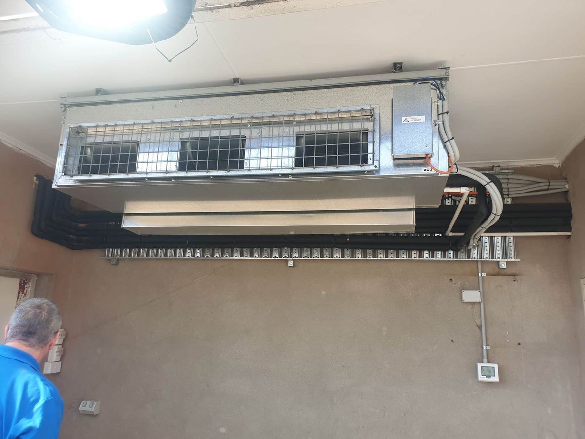 An Industrial Ceiling-mounted Hvac Unit — Premiair Refrigeration, Air Conditioning & Electrical in Tamworth, NSW