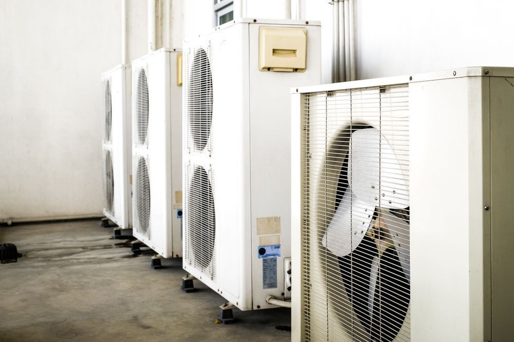 A Row of White Industrial Air Conditioning Units — Premiair Refrigeration, Air Conditioning & Electrical in Narrabri, NSW