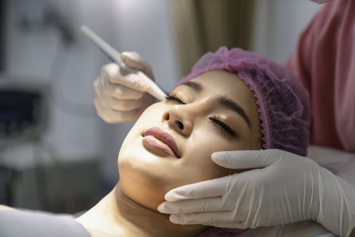 Young Woman Receiving Facial Microdermabrasion Treatment. - Chamberlain, SD - Rejuvenating Remedies Med Spa