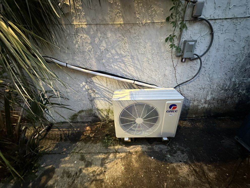 Outdoor ductless HVAC installation with mini split condenser unit in Wilmington, NC
