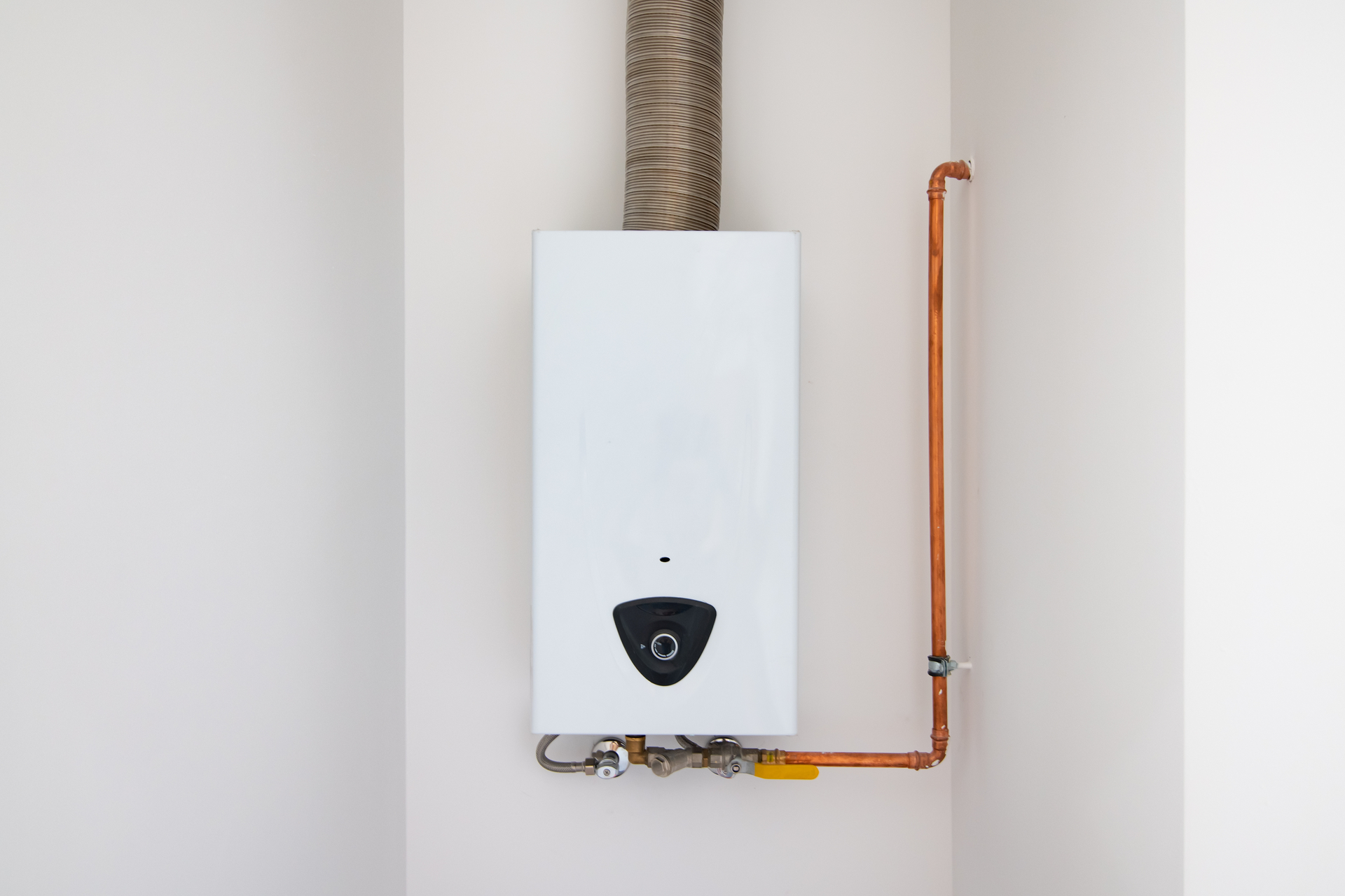 Technician performing HVAC repair work on compressor using torch – hvac repair service near you