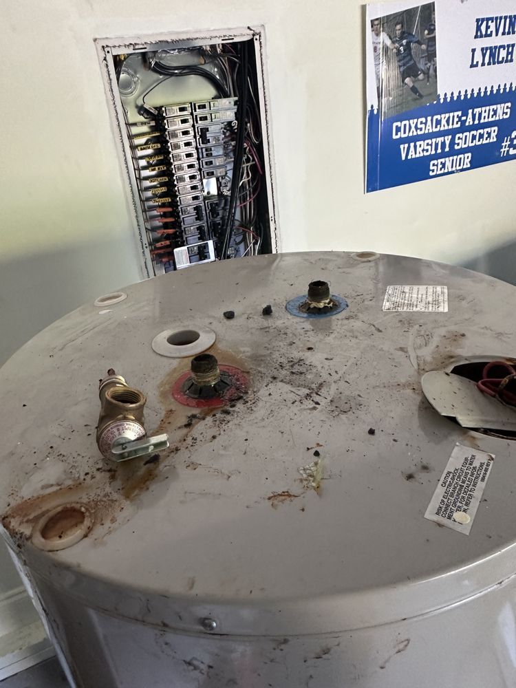 Water heater removal in progress during water heater installation service near you