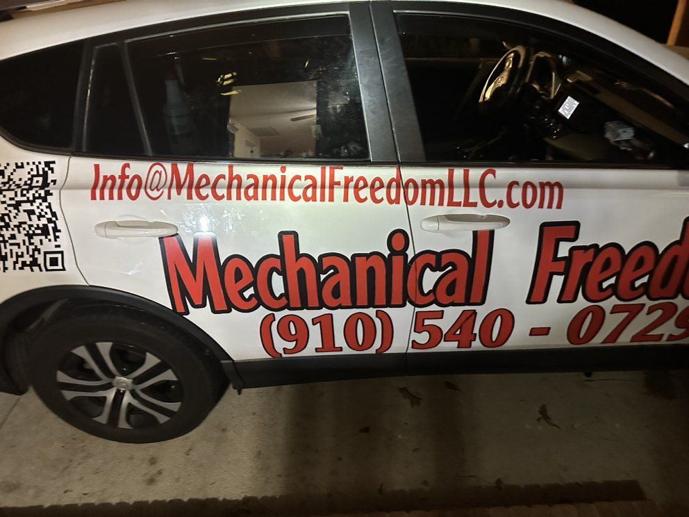 Mechanical Freedom LLC HVAC repair service vehicle with contact info