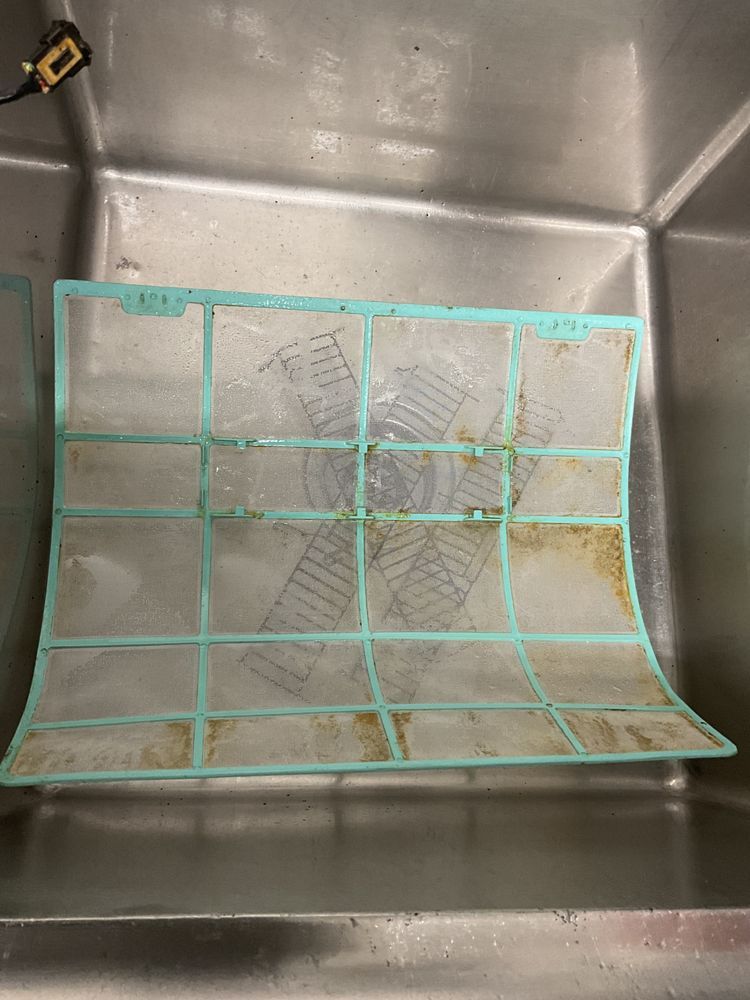Dirty HVAC filter during regular HVAC maintenance cleaning process