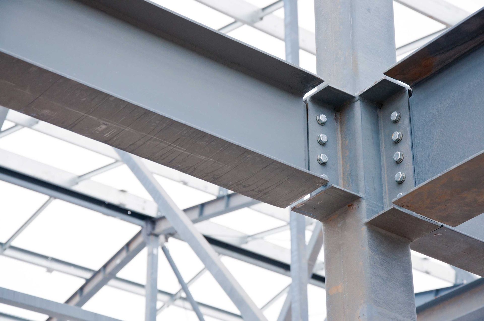 View of a steel structural support of a commercial building under construction. View of a steel structural support of a commercial building under construction.