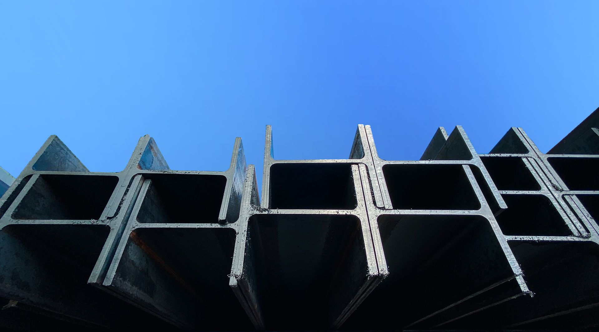 Steel beams production. Metal profile beam Steel in packs at the warehouse of metal products
