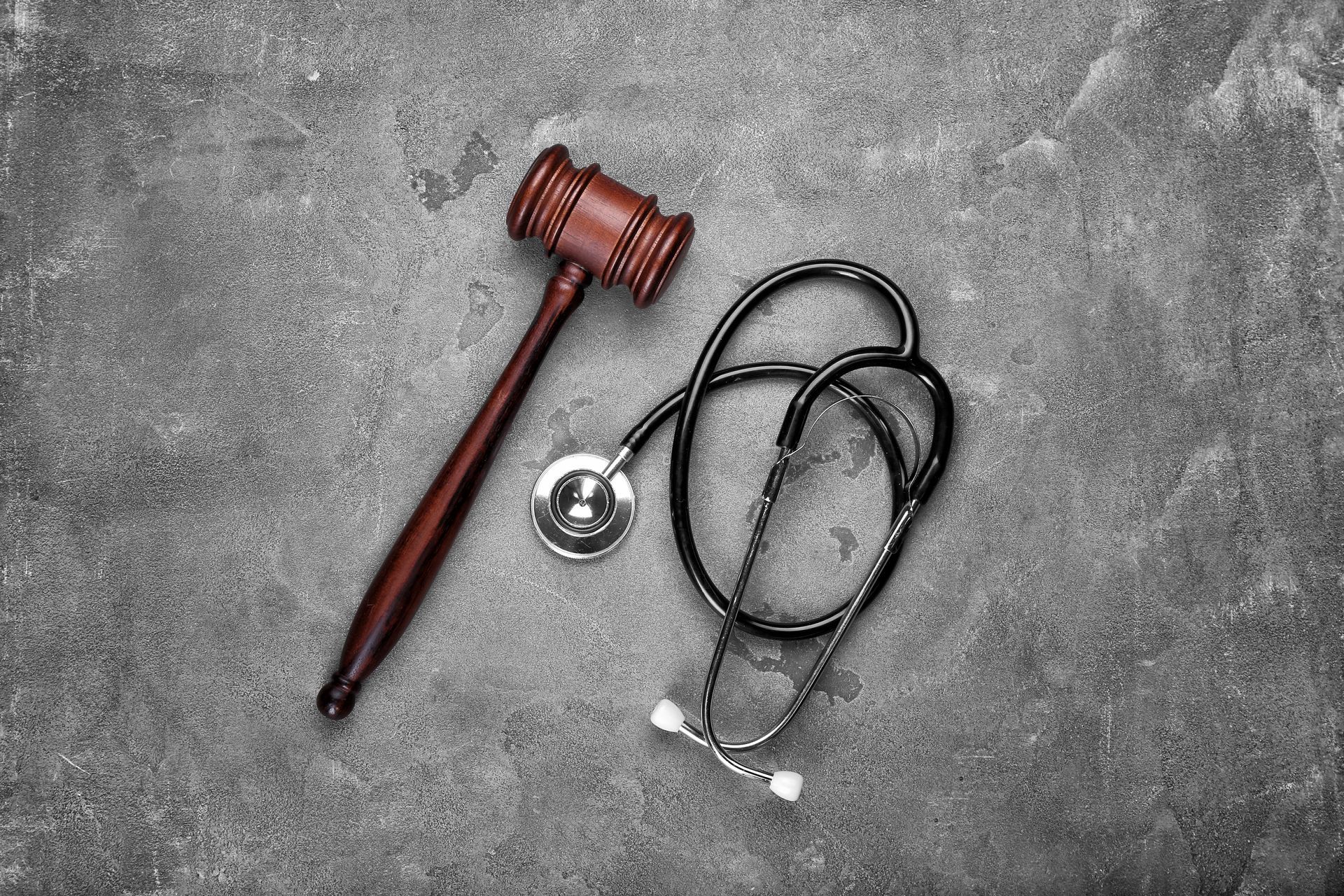 Wooden gavel and stethoscope, representing medical malpractice attorney in Georgia.