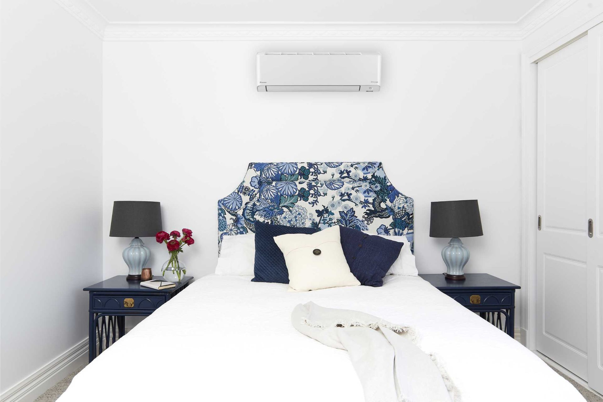 A Bedroom With a Bed, Nightstands, Lamps and a Ceiling Fan — Enterprise Air That's Cool in Svensson Heights, QLD