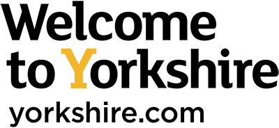 The logo for welcome to yorkshire.com is black and yellow.