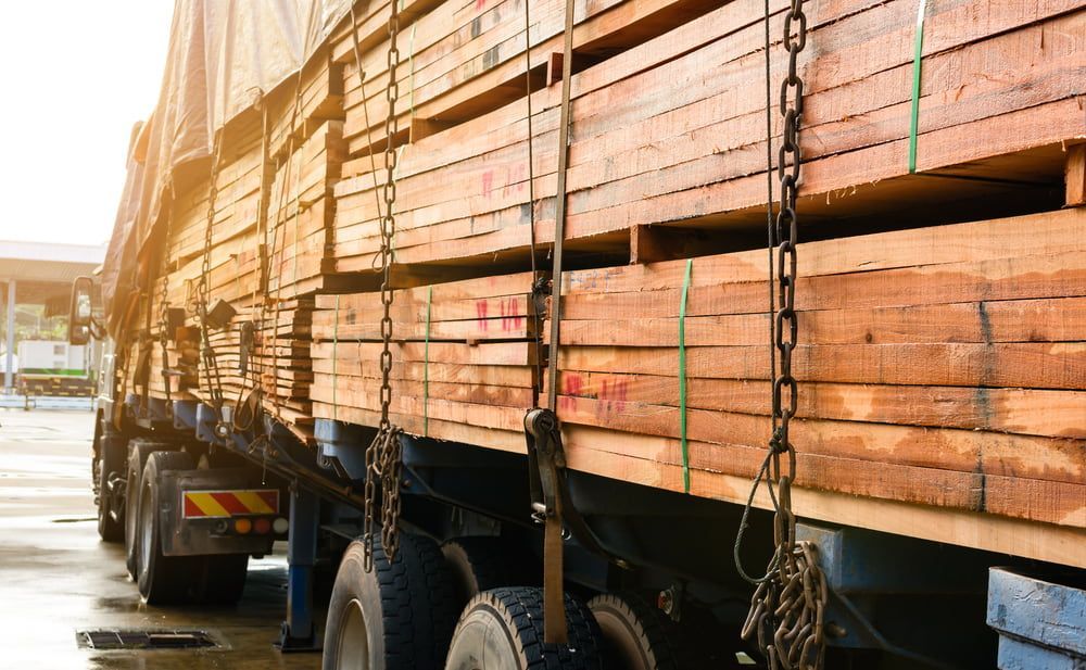 A Truck Is Loaded with Wooden Pallets and Chains — Adam's Sawmill in Armidale, NSW