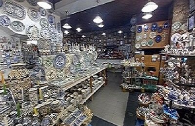 A store filled with lots of plates and figurines.