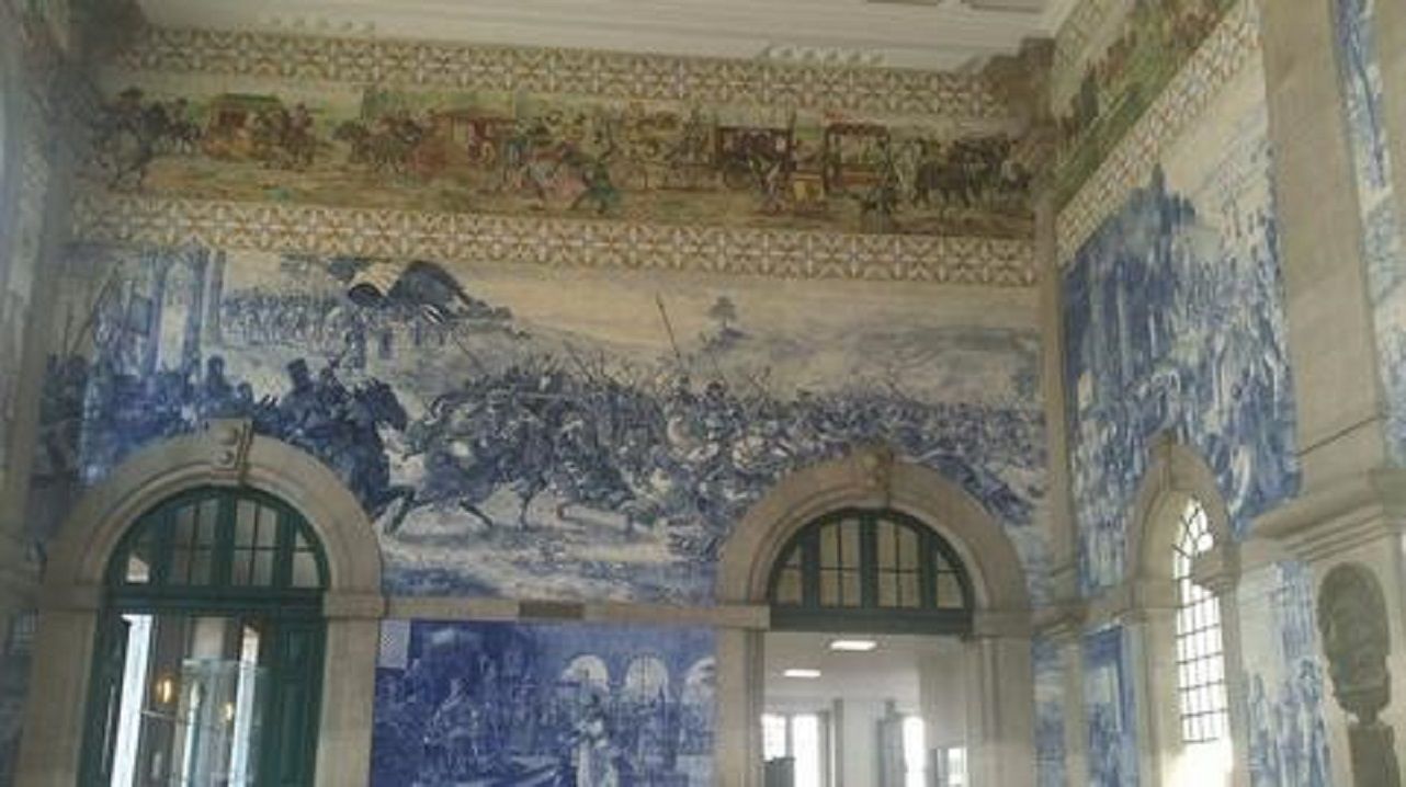 A wooden walkway with palm trees in the background